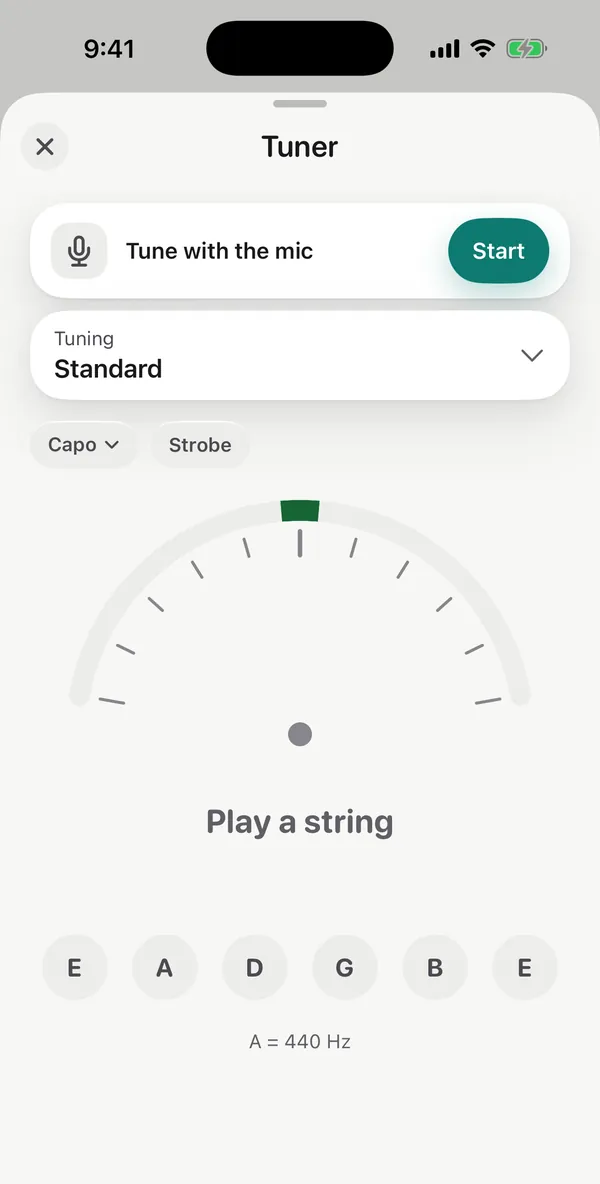 The tuner in standard tuning, with Capo and Strobe options, a needle gauge and the six strings.